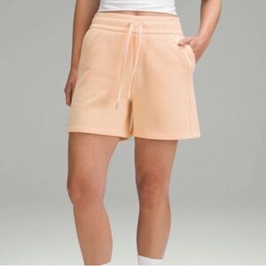 Lululemon Scuba High-Rise 5" Shorts in the color Peach Bellini